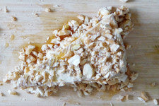 Brie Drenched in Honey topped with finely dices Macadamia nuts and Grand Marnier 